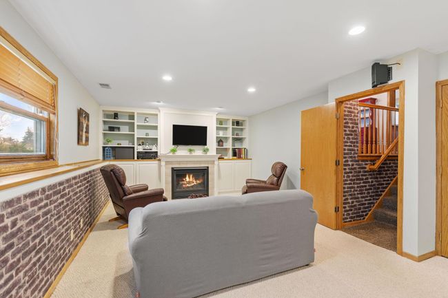 Light, bright and cozy lower level, fireplace | Image 23