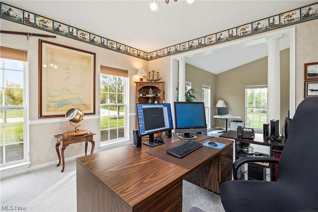 Carpeted home office with ornate columns and vaulted ceiling | Image 6