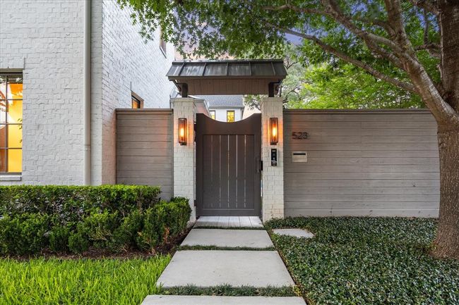The front gate auto locks and the home has exterior cameras controlled by the Hik-Connect app. | Image 39