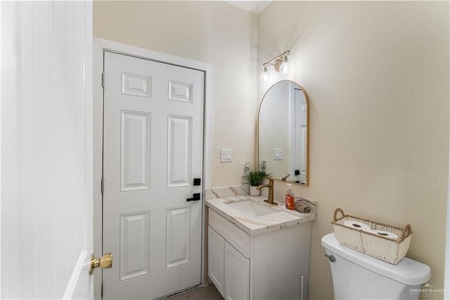 Bathroom with toilet and vanity | Image 15