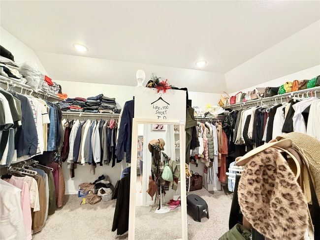 Walk in closet with carpet and vaulted ceiling | Image 32