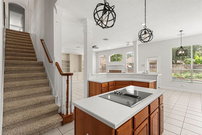 A second staircase off kitchen offers convenient access to the upstairs. | Image 10