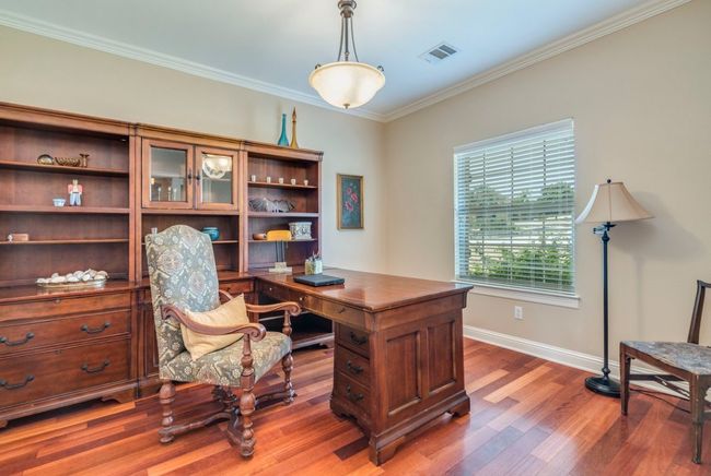 Office space with crown molding, light wood floors | Image 17