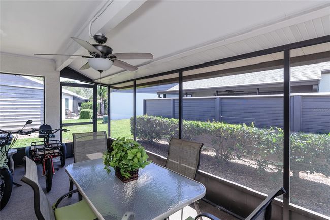 Large screened lanai for enjoying fresh Gulf breezes. | Image 14