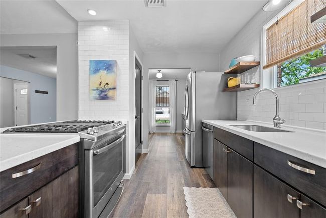 Walking into the kitchen from living room. | Image 18