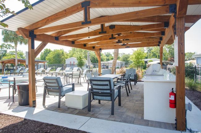 View of patio featuring exterior kitchen and a gazebo | Image 33