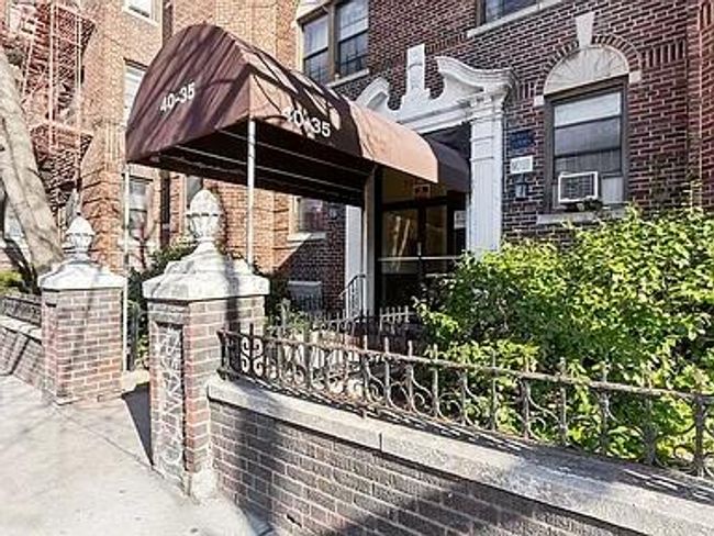 View of side of property featuring brick siding and cooling unit | Image 9