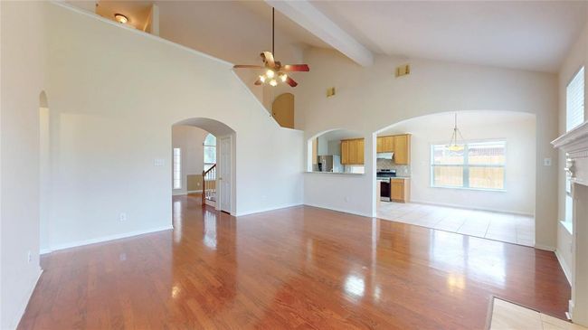 Main spacious living room with high ceilings, and open to kitchen and | Image 9