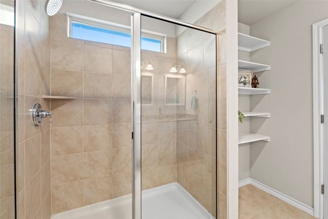 Primary bathroom featuring a walk-in shower | Image 22