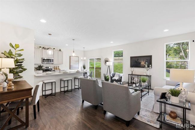 Living room with dark wood-style flooring and recessed lighting | Image 10