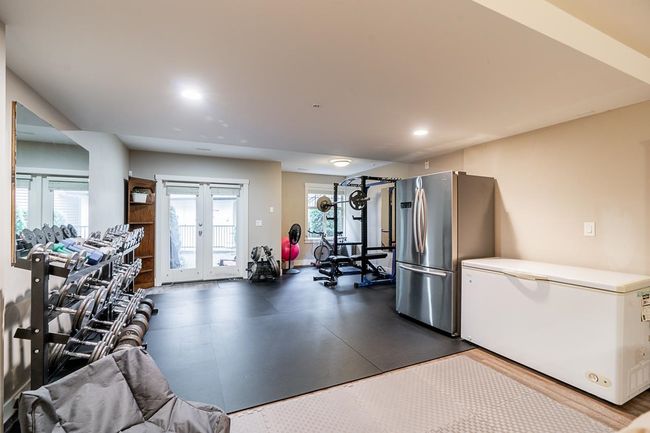 Exercise room with french doors and recessed lighting | Image 29