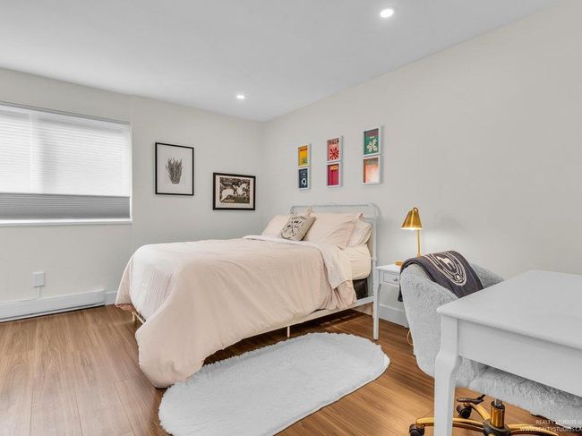 Extra large, bright beautiful bedroom with all new flooring, closet with shelving system, new doors, and new south facing window. | Image 33