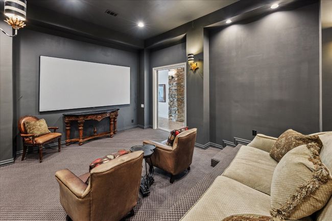 The home theatre is near the recreation room, full bath and the pool area. | Image 28