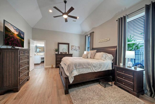 Bedroom with light wood-type flooring and multiple windows | Image 16