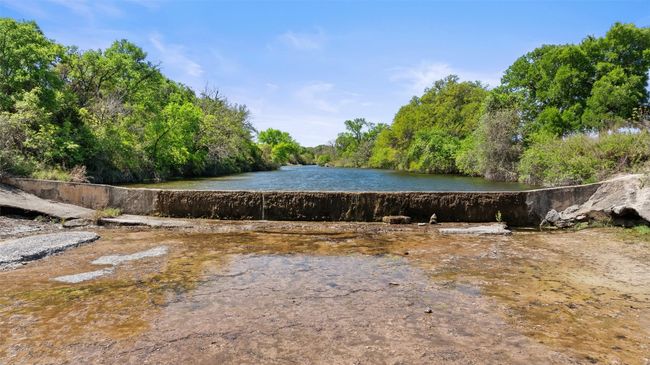 View of water feature with a view of trees | Image 4