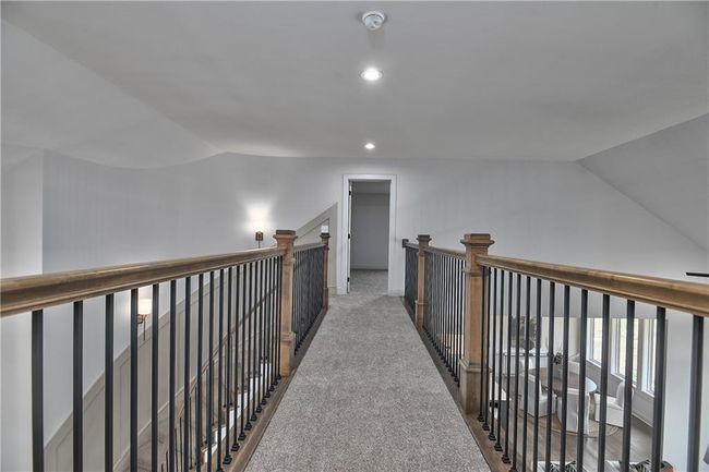 Hall with carpet floors and vaulted ceiling | Image 35