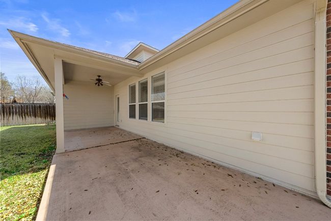 View of patio / terrace with a ceiling fan and fence | Image 19