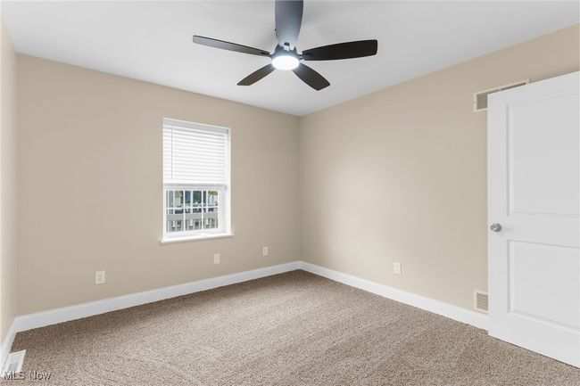 Unfurnished room with carpet floors and ceiling fan | Image 19