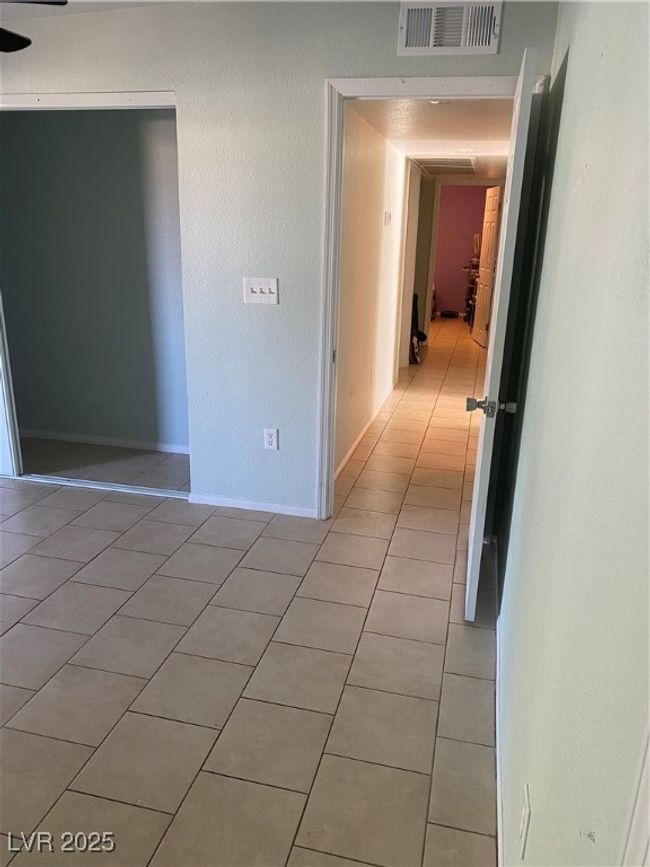 Spare room with baseboards, visible vents, and light tile patterned floors | Image 34