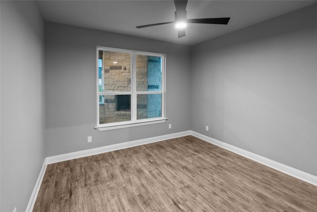 Unfurnished room featuring wood finished floors and ceiling fan | Image 25