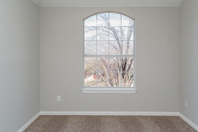 Spare room featuring carpet floors and baseboards | Image 23