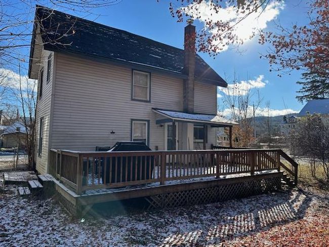 Rear view of property featuring a wooden deck | Image 23