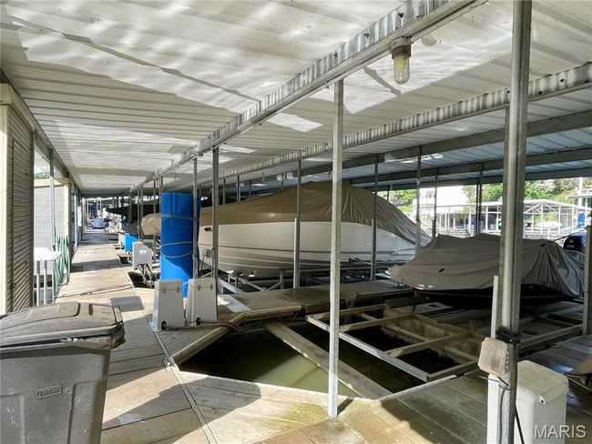 Dock featuring boat lift | Image 97