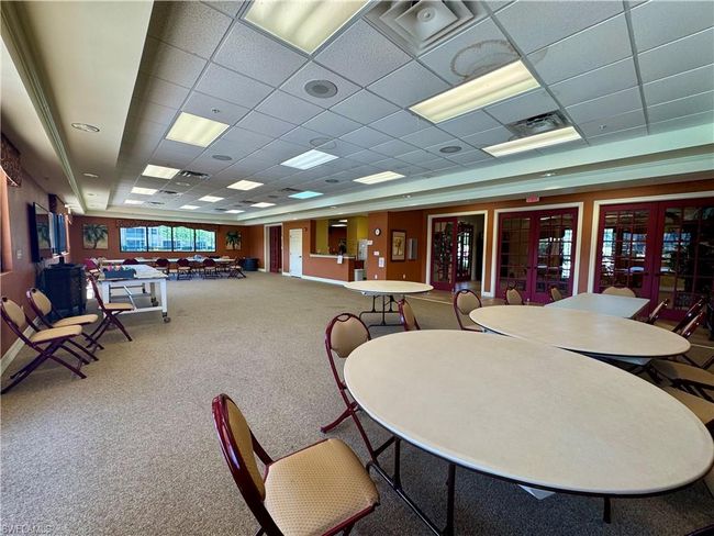 Carpeted dining space with visible vents and a drop ceiling | Image 36