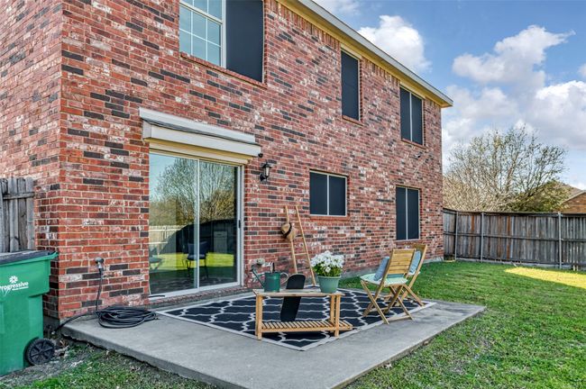 Rear view of house featuring a yard, fence, and brick siding | Image 31