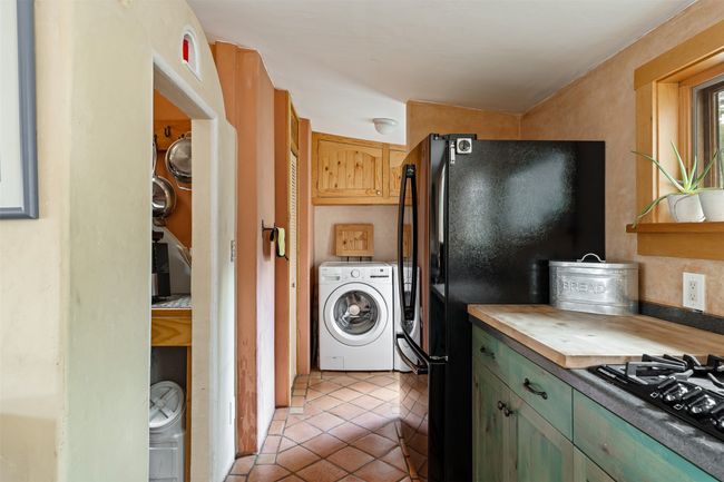 Kitchen, walk-in pantry to left, laundry in background | Image 17