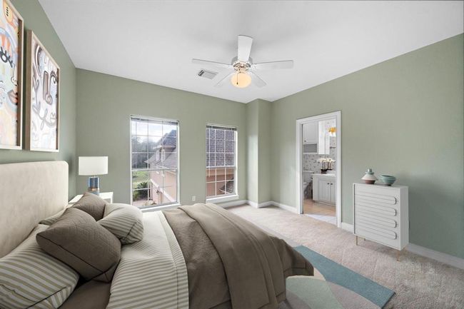 This is one of the three bedrooms located on the upper level, providing peaceful vistas overlooking the estate's front grounds. | Image 33