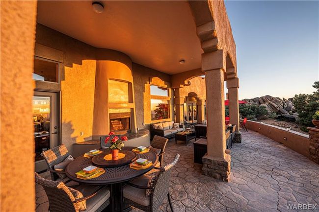 View of patio with an outdoor hangout area | Image 27