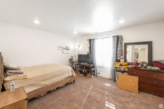 Bedroom with light carpet and recessed lighting | Image 8