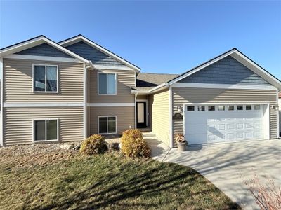 View of front of home featuring a garage and a front lawn | Image 1