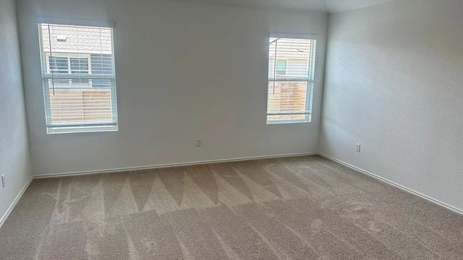 Carpeted spare room with a textured wall | Image 12