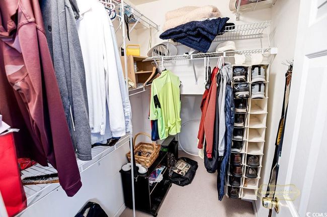 Walk in closet featuring carpet | Image 25