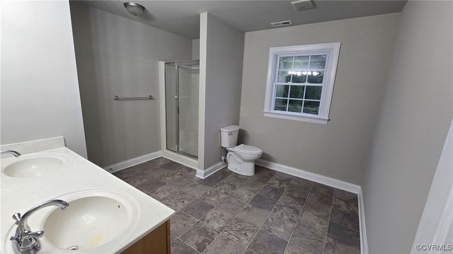 2nd Floor Full bathroom with double vanity, visible vents, baseboards, and a sink | Image 32
