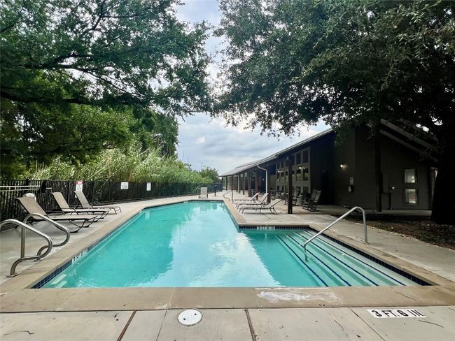 Community pool featuring a patio area. | Image 38
