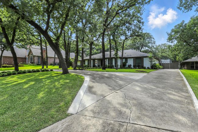 Ranch-style house featuring driveway and a front yard | Image 7