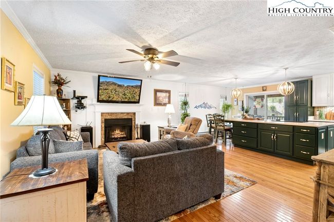 Cozy but spacious living room open to the kitchen | Image 9
