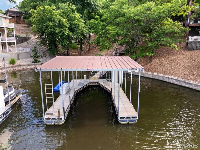 Dock with boat lift and a water view | Image 37