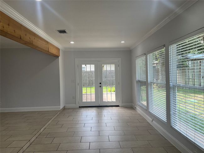 Unfurnished room featuring plenty of natural light, french doors, recessed lighting, and crown molding | Image 6