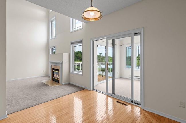 Access the deck through the 4-season sunroom right off the dining area. | Image 7