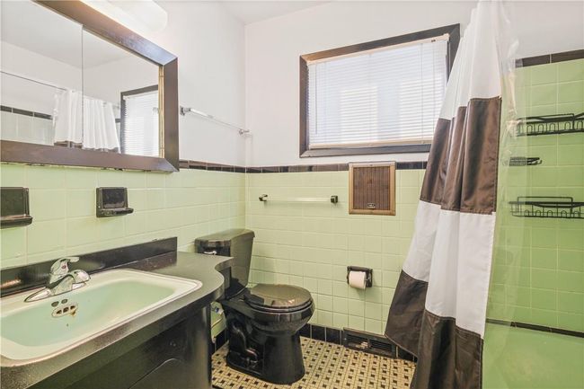 Bathroom with vanity, walk in shower, tasteful backsplash, tile walls, and toilet | Image 23