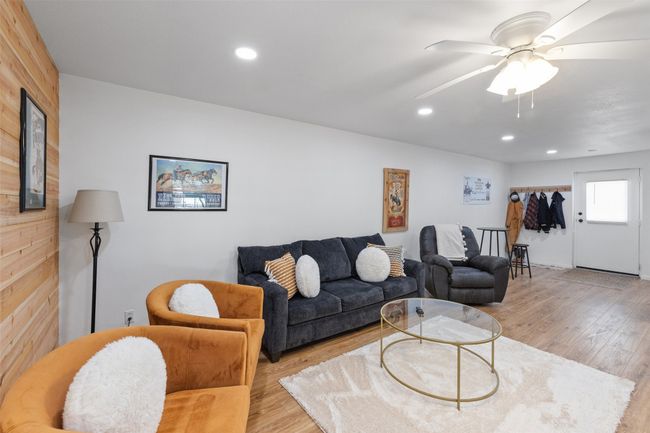 Living room with recessed lighting, a ceiling fan, and light wood-style floors | Image 28