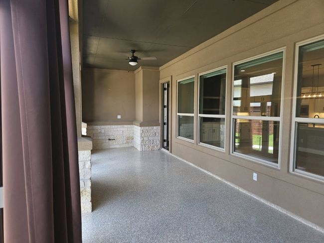 View of patio with a ceiling fan | Image 10