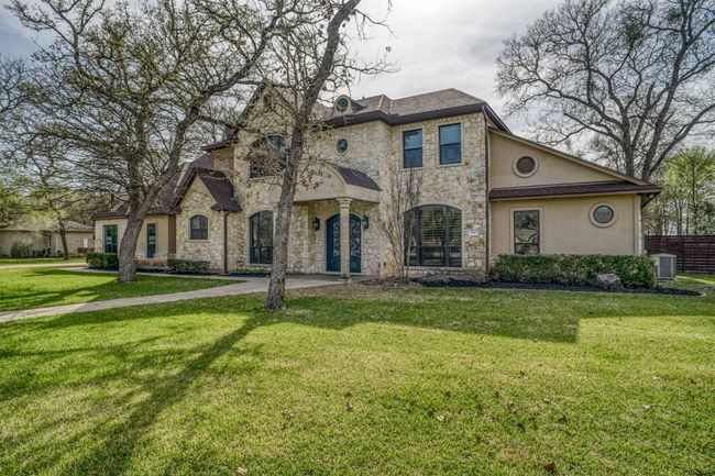 Front of this luxury custom home. Schedule your showing today! | Image 40