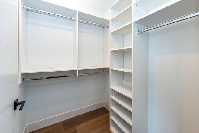 Custom-designed walk-in closet for optimal storage. | Image 28