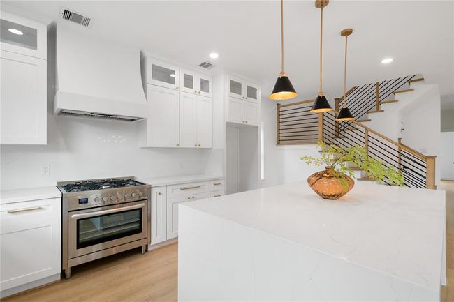 Custom vent hood and commercial grade gas range | Image 13