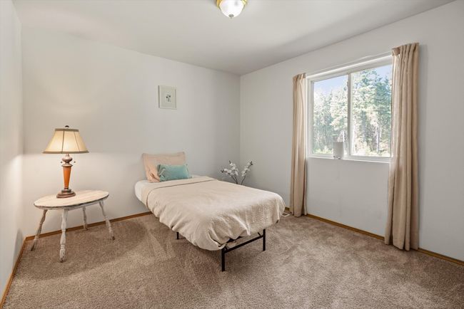 Bedroom featuring carpet and baseboards | Image 23